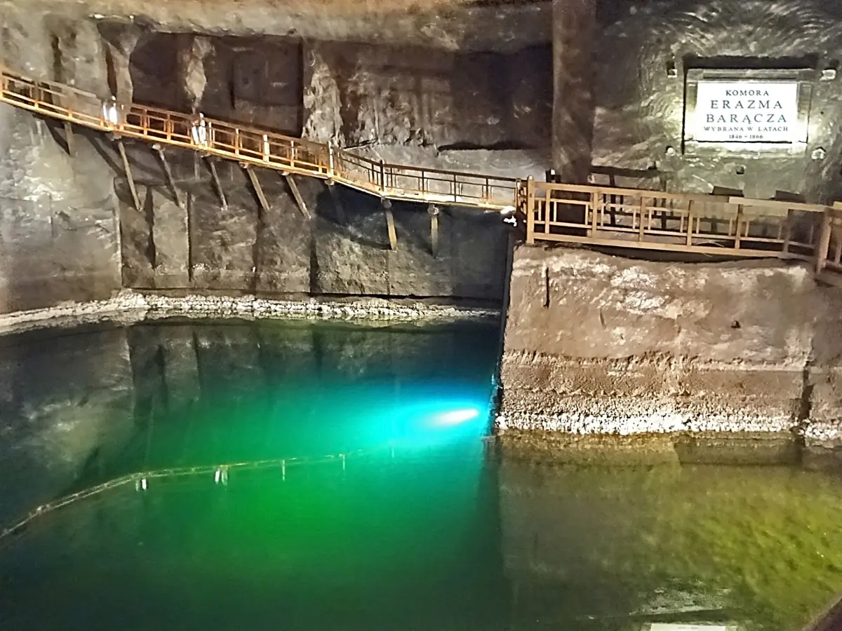 Underground brine lake lit green in the mine